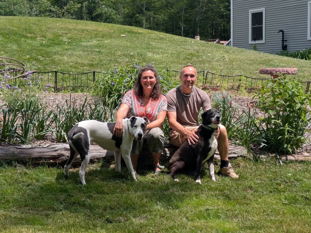 Autumn Allen with her family and dogs in a garden